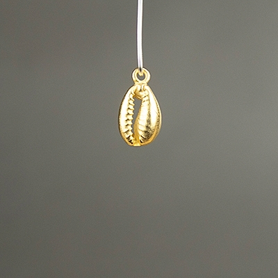 gold cowrie shell charm