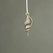 MET-00317: 24mm Antique Gold Spindle Shell Charm - MET-00317